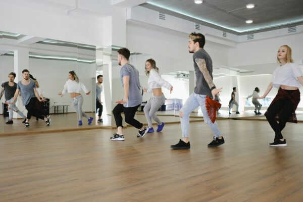 Group of young modern dancers dancing in the studio