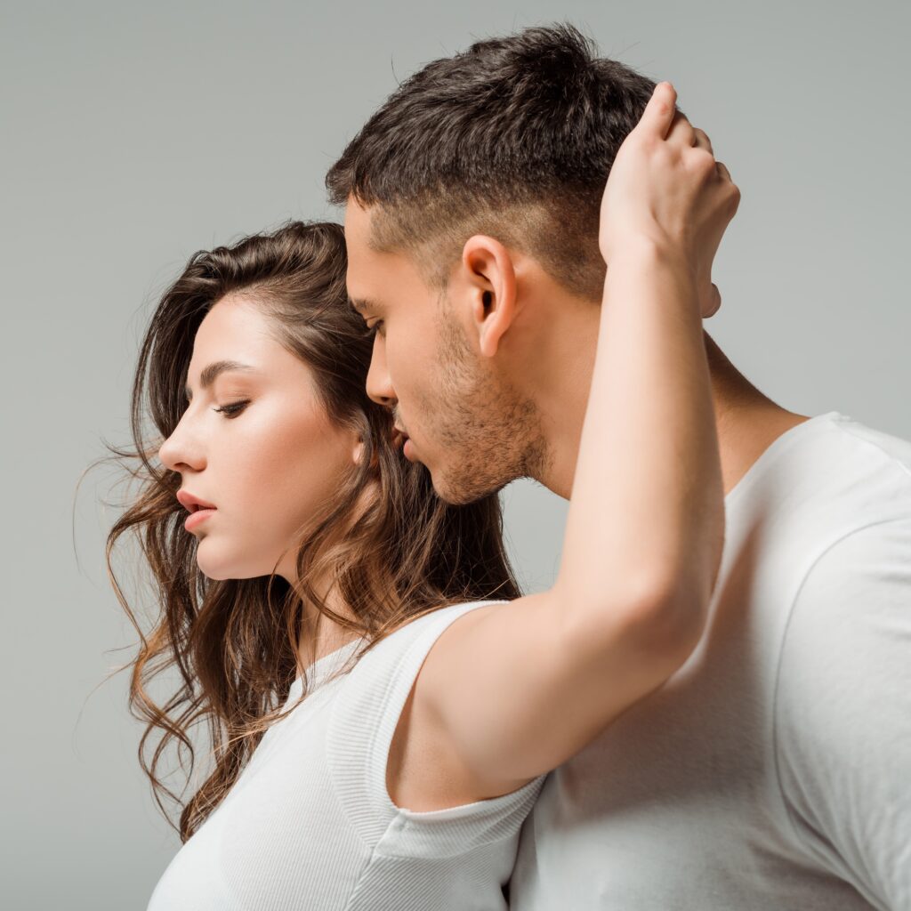 dancers in t-shirts dancing bachata isolated on grey